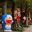 Anime character statues in front of the Bandai building in Asakusa