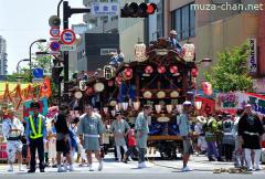 Floats parade waiting for the traffic light