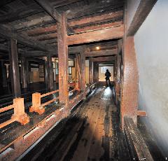 Japanese castle interior, warriors running passage